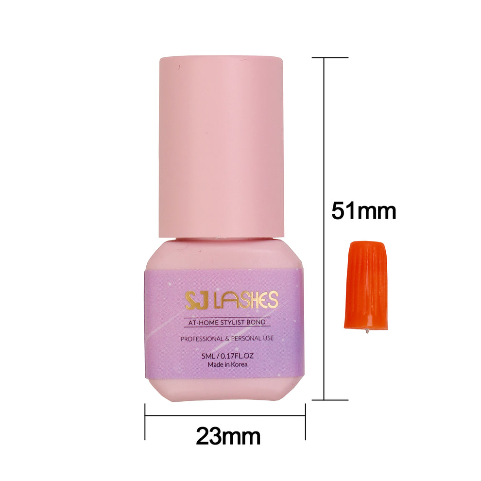Size chart of the SJ LASHES At-Home Stylist Bond 5 ml lash glue bottle measuring 51 mm high and 23 mm wide with an orange needle cap